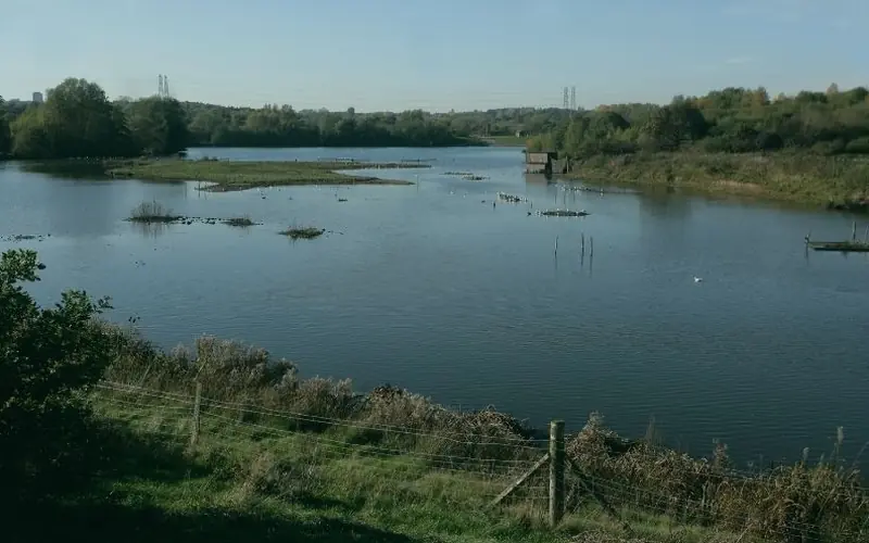 Lake and bird hide in Sandwell Valley